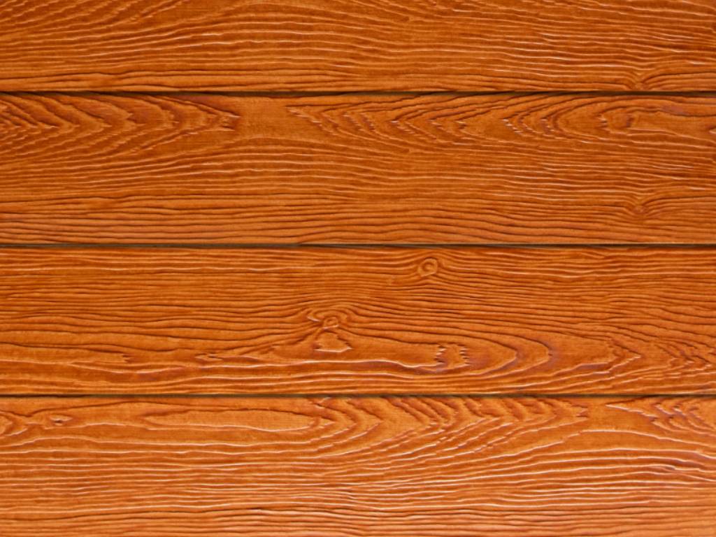Stapels Shera gevelplanken in de kleur walnut brown, geschikt voor duurzame en onderhoudsarme geveltoepassingen.
